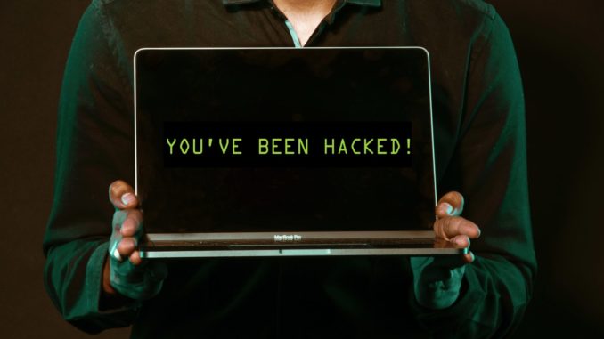 man-holding-laptop-computer-with-both-hands-2036656